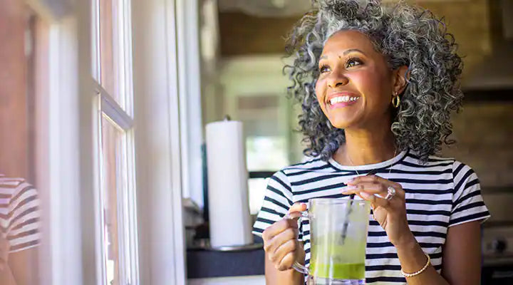 Middle age women drinking sea moss 